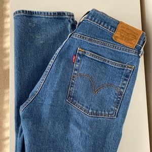 Levis wedgie straight in a medium wash size 27, worn less than a year. No flaws.